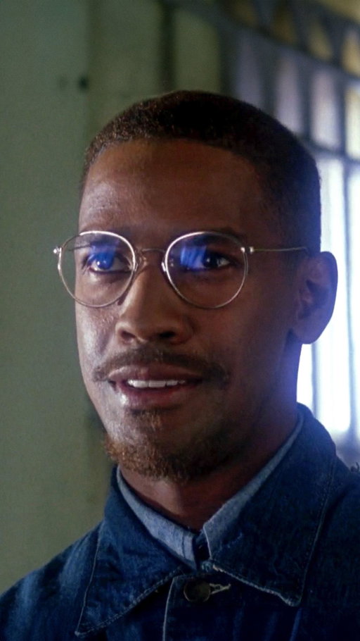 In Malcolm X (1992), Denzel Washington delivers one of the most mind blowing performance that will be remembered for generations. 

Speaking to a crowded room of Black men, his character challenges centuries of racialized religious imagery, using faith as a lens to expose how power and identity have been shaped by white supremacy. When Malcolm points to a picture of a white Jesus and asks why Black people worship an image that looks nothing like them, he forces the audience to confront how deeply colonial narratives have entered their consciousness. This monologue reflects a larger theme in Malcolm X (1992): the struggle for self-definition. By dismantling the false symbols imposed on his community, Malcolm redefines faith as empowerment rather than submission. Religion, in his view, should not reinforce oppression but challenge it.