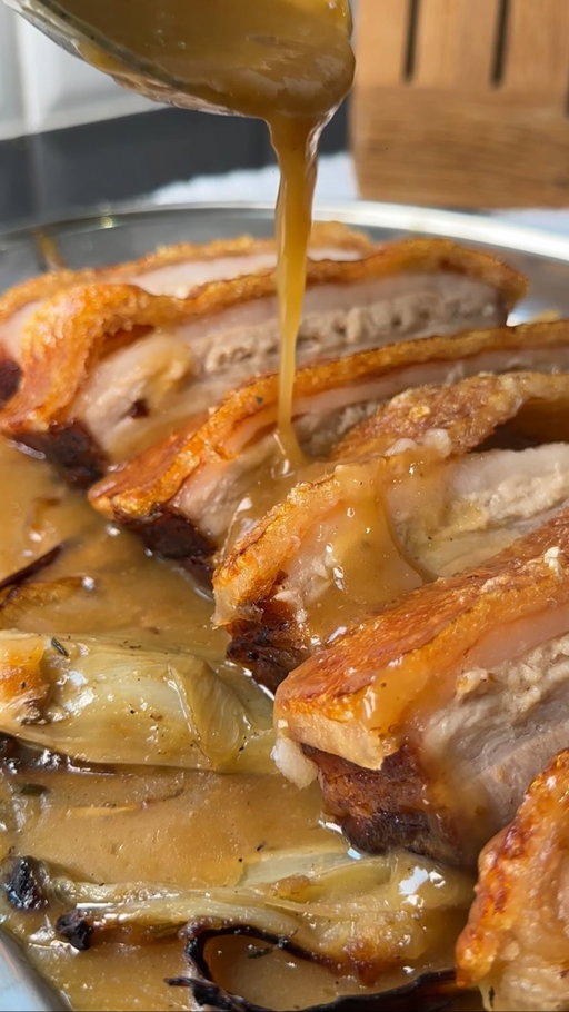PERFECT PORK BELLY 🐖🔥

@cud_cooks x @robertwelchuk AD

Crispy skin, tender meat, caramelised fennel, and a rich cider gravy - this is the perfect pork belly. Slow-roasted for tenderness, finished at high heat for crackling, and served with roasted fennel, shallots, apples, and thyme.

Recipe below ⬇️

Pork: Place a 2.5kg pork belly in the fridge uncovered overnight. Next day, wrap foil so it covers just the meat, leaving skin exposed. Brush with olive oil, season with salt, and roast at 140°C for 2½ hours.
Veg: In a casserole pot, combine 2 quartered fennel bulbs, 6 halved shallots, 1 halved garlic bulb, 2 apples (cut into sixths), thyme, fennel seeds, salt, pepper, and olive oil. Roast for 1 hour in the same oven.
Combine: Pour pork juices into the veg, then roast both together at 240°C for 30-40 mins to crisp the skin. Remove the pork and rest uncovered
Gravy: Deglaze the casserole with 1-2 bottles cider, boil, strain, and reduce until glossy.
Serve the veg in a dish, spoon over the cider gravy, and slice the pork to serve on top.

#porkbelly #pork #roast #recipe