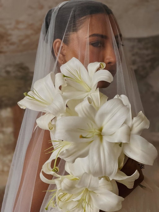 We wanted our wedding to feel intimate and intentional, surrounded by a place that felt timeless and Villa Cetinale was the perfect backdrop.

We used only lilies throughout the day. Both Bangladesh and Vietnam have native water lilies, and while these weren’t the same, the Oriental lilies felt like a reflection of both of us, flowers I grew up with in London and ones Trieu often gifted me.

My bouquet was a cascade of lilies, and seeing them line the ceremony and dinner felt so personal. My best friend Jasmine sang Can’t Help Falling in Love during dinner, which was one of our favourite moments of the day 🤍

Wedding planner @morettievents 
Photographer @theferros 
Content creator @silvi_lubilubi 
Makeup: @danielaxalves 
Dress @septnewyork 
Trieu’s suit & shoes @tomford 
Flowers @biancospinoflowers 
Venue @cetinale