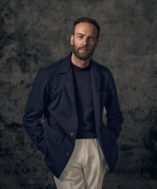 We are delighted to unveil one of our most beloved creations — the Perfect Navy Traveller’s Jacket, crafted in collaboration with Andreas Weinas and the esteemed Loro Piana mill.
 
Season after season, this exceptional piece has consistently sold out across our partner boutiques and private trunk shows, a testament to its timeless appeal. Tailored from an exclusive pure wool blend , woven especially for us at a distinguished weight of 440 grams, it embodies refined versatility — the perfect balance between business sophistication and relaxed elegance.
 
We’ve paired it with a statement striped shirt — defined by its distinctive texture and almost sleek, paper-smooth finish. Refined yet daring, it brings a sharp edge to classic sophistication, embodying confidence and modern power in every detail.
 
Experience our new collection — a fusion of time-honoured tailoring and contemporary ease, where craftsmanship meets effortless sophistication.
 
We also introduced the Perfect Navy Traveller’s Jacket at Galeries Lafayette Mumbai, debuting tomorrow as the iconic store opens its doors for the very first time in the city.