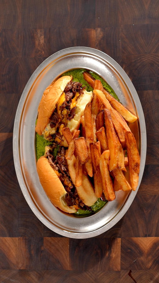 Smash Burger and Frites? 😩

Ingredients

French Fries:
- Russet potatoes
- Frying oil (I used peanut oil)
- Salt

Smash Burgers:
- Potato buns
- 80/20 Ground beef (each patties are about 65g)
- Pickles
- American cheese
- Burger sauce: 1 cup mayo, 1/2 tbsp mustard, 1/4 cup relish, 2 tsp paprika, 2 tsp onion powder and 1 tsp vinegar

Entrecote Sauce:
- 200 g Butter
- 1 Shallot
- Herbs: 1 bunch of parsley, 5 sage leaves, 5 basil leaves and 5 taragon leaves
- 5 Walnuts
- 1 tsp Nugmet
- 6 Anchovies
- 10 Cappers
- 1 Lemon
- 1 Egg yolk
- 1 TBSP Dijon mustard
- 1 tsp Worcestershire sauce
- Splash of Vinegar

Instructions

French Fries:
- Peel and cut potatoes into strips and boil them for 5 minutes before fully cooling them down.
- Fry them at 350F for 5 minutes and let them cool down again.
- Fry one final time at 370F for about 2 minutes or until brown and crispy.
- Salt heavily.

Smash Burgers:
- Sear on a high heat and smash the patties in a circular motion until flat (1 minute) before flipping and adding a slice of cheese. Once the cheese has melted (30 seconds), remove the patty from the pan.
- On a toasted bun, add buger sauce, pickles, the patties, more burger sauce and the top bun.
- Slice the burger in half and sear the cross section on medium heat.

Entrecote Sauce:
- On low heat, cook shallots in butter.
- Combine the melted butter and shallots with herbs, walnuts, nutmeg, anchovies, cappers and a peeled lemon before blending.
- Whisk an egg yolk with dijon mustard, worsestershire sauce and vinegar before slowly emulsyfying with the green blend.
