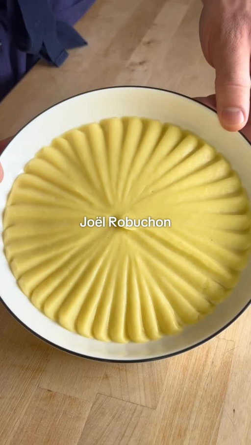 How to Make Joël Robuchon’s Mashed Potatoes 🥔🇫🇷 🥔🇫🇷

FULL RECIPE BELOW ⬇️

INGREDIENTS: 
1.25kg ratte potato (or Yukon gold) (your yield should be 1kg after peeling)
250mL whole milk **
250g unsalted butter, diced 
4-5 sprigs thyme
1 tsp black peppercorns
2 cloves garlic, gently smashed
Fine sea salt, to taste

** All of this milk likely won’t be needed. Some can be kept aside to re-heat the potatoes later.

INSTRUCTIONS:
1. In a large, heavy bottom pot, ideally large enough to fit all your potatoes in a single layer, cover your potatoes with cold water. Bring to a boil over high heat, then lower your heat to medium. Allow your potatoes to cook for 20-30 minutes, or until you can pierce your potatoes with a pairing knife with zero resistance. 
2. While your potatoes are cooking, bring your milk to a boil with your thyme, garlic and black peppercorns. As soon as it comes to a boil, turn off the heat and allow the aromatics to steep while the milk stays hot.
3. When your potatoes are done cooking, strain them, and let them sit in the strainer for 5-10 minutes to allow steam to be released. Once they are cool enough to touch, but still hot, peel the potatoes & discard the skins.
4. Press your potatoes through a potato ricer into a large bowl. Strain the aromatics out of your milk, and pour half of the milk into the riced potatoes. Fold the milk gently into the potatoes until incorporated. Then, pass your potatoes once more through a fine mesh strainer into a large pot (this step is optional, but does result in THE smoothest potatoes).
5. Put the pot over low heat, and add a couple tsp more milk as needed until your potatoes are smooth. At this point, you can decide how smooth/luxurious you would like your potatoes. If you want them to be more of a "purée", add all of the butter and extra milk for the true Joel Robuchon Ratio. If you want more of a traditional mashed potato consistency, don’t add any more milk, and only add half the butter. Regardless of what you choose, at this point you can season your potatoes with salt to taste. Serve your potatoes as a side with any roast or braised meat, and enjoy! 

#mashed #potatoes #michelin #homecooking #Recipe