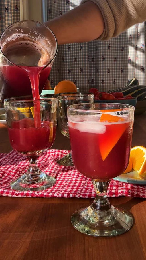 Here’s how to make @grossypelosi’s Nonalcoholic Negroni:

• 1 medium navel orange
• 10 hibiscus tea bags, such as Celestial Seasonings Red Zinger
• 1 tablespoon whole black peppercorns
• 1 tablespoon whole cloves
• ½ cup sugar
• 2 (12-ounce) cans tonic
• 1 cup unsweetened grapefruit juice
• Ice, for serving
• Orange wedges, for serving

Use a vegetable peeler to peel the orange, avoiding as much white pith as possible. In a small saucepan, combine the orange peel with the tea bags, peppercorns, cloves and 2 cups water. Bring to a boil over high heat.

Add the sugar and cook, stirring, until dissolved, about 1 minute. Cover, remove from the heat and let cool completely, about 2 hours. Strain the tea and discard the solids. The cooled, brewed tea can be refrigerated in an airtight container for up to 2 weeks.

To serve, in a large pitcher, stir together the tea, tonic water, grapefruit juice and about 1 cup ice. Divide among rocks glasses filled with ice and garnish with orange wedges.

Tip: To make one serving, fill a rocks glass with ice. Pour in 1 ounce of grapefruit juice, 2 ounces of the tea and 3 ounces of tonic water; stir to mix. Garnish with an orange wedge.
