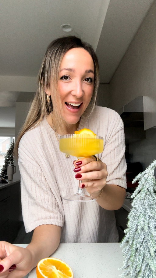 2 Ingredient Orange Rose Mimosa Cubes 🍊

With just a splash of orange juice, fresh orange slices, and a big ol’ ice cube mold, you’re on your way to the fanciest glass of bubbly you’ve ever sipped.

These a) keep your bubbly colder for WAY longer and b) are the cutest flipping cubes you’ve ever seen. 

All my tips, tricks, and links are on the blog! Comment “recipe” and I’ll send the full recipe and directions straight to your DMs! https://basicswithbails.com/course/drinks/orange-rose-ice-cubes/

INGREDIENTS -
2 large oranges
1 1/2 cups orange juice (approx)
Big ice cube molds (linked on my blog post & on Amazon storefront)

DIRECTIONS -
1) Slice your oranges thinly, then cut each slice in half to make semicircles. This will allow them to be easily folded into rose shapes.
2) Take 3-4 half-slices and fold them into the mold, layering them so they resemble the petals of a rose. Adjust the pieces as needed to achieve the rose look.
3) Carefully pour orange juice into each mold, filling to just below the top. The orange juice will freeze around the orange slices, holding them in place and enhancing the flavor.
4) Place the tray in the freezer for at least 4-5 hours or until completely solid. For best results, freeze overnight.
5) Pop out the Orange Rose Ice Cubes and add them to a glass of bubbly to create a gorgeous, citrus-infused mimosa!

#holidaycocktail #mimosarecipe #orangejuicecubes #orangeroses #easydrinks #fundrinks #festivedrinks #festivecocktails