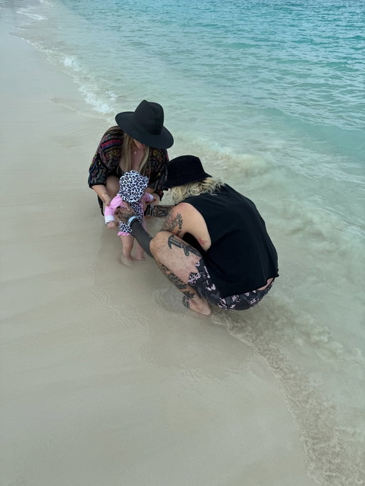 Nikki’s first time with her feet in the sand ☀️😎