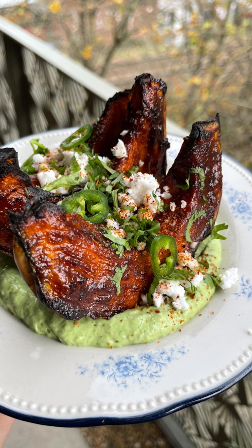 Sticky chipotle pumpkin on the creamiest avocado and jalapeño sauce ✨

After a stupid number of you loved and recreated my last pumpkin recipe I thought I’d give you another version. Just as sticky, sweet and savoury but with a slightly diff flavour profile with smoky chipotle, zingy lime, earthy cumin and a bit of brightness from orange zest. It’s a real real winner 🤝

RECIPE
½ crown prince pumpkin
Extra virgin olive oil
Flakey salt

3 tbsp chipotle paste
3 tbsp agave
1/4 orange zested
½ lime, juice
1-2 garlic cloves, grated
1/2 tsp ground cumin
½ tsp smoked paprika
1 tsp soy sauce
Salt and freshly cracked pepper, to taste

15g fresh coriander (stems included)
100g thick vegan greek yoghurt
½ avocado
½-1 fresh jalapeno
1 spring onion, greens only
Salt to taste

To garnish:
A handful coriander, finely chopped
Thinly sliced jalapeño
50g vegan feta, crumbled
Tajin

1. Preheat the oven to 180 fan or 200C. Take half the squash and remove the seeds. Cut it into 4-5 thick wedges, leaving the skin on. Place the wedges onto a tray, drizzle with a splash of oil and salt then place into the oven to roast for 45-50 mins.
2. Whisk together all the ingredients for the glaze. After 45 minutes baste the squash wedges with the sticky glaze. Repeat again after 10 mins then switch to grill/turn the heat up to caramelise the sauce. Baste as many times as you want to get a nice thick coating of the sauce.
3. Blend the ingredients together for the avocado crema and season to taste.
4. Spoon the crema onto a plate, place the pumpkins on top and top with the garnishes. 

#pumpkin #squashrecipes #easyveganmeals