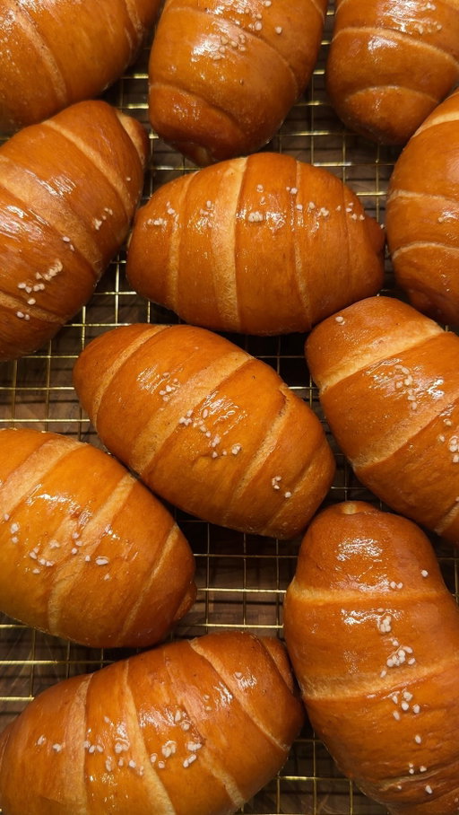 HOW TO MAKE SALT BREAD 🥐 i wanted to answer some of the questions i was getting about my salt bread recipe so i wanted to make a longer more in depth tutorial 

recipe link: https://erinscozykitchen.com/recipe/salt-bread-shiopan/

comment “recipe” to receive the recipe via DM! or look up “erinscozykitchen salt bread” on google and it should be the first link that pops up!

- can i replace milk powder with milk: yes you can just replace some or all the water with milk but it will change the crumb and texture and browning, if u can i would recommend using milk powder
- why cold water: when you knead your dough it will rise the temp and you want it to end up at around 78 fahrenheit when u go to do the first rise. high dough temp will affect the taste and gluten development of the dough 
- why is my dough sticky: your dough has either gotten too high in temp that the gluten is breaking down or you haven’t kneaded it long enough and it’s just underdeveloped (DONT add more flour to your dough just bc it’s sticky while you’re kneading it shouldn’t need any flour if you kneaded it long enough)
- how long do you knead: this depends on your mixer and speed, with my ooni halo pro it took me about 14 min total but with a kitchen aid it could take longer and by hand even longer 
- where is my salt bread pan from: 
i got it in korea at bangsan market! it's a neighborhood that sells a lot of wholesale baking and packaging supplies. i couldn't find anything similar in the states but tbh i don't think it really makes that big of a difference! 

tips:
• make sure you fridge your butter after you cut it, you want to roll it up with hard/cold sticks of butter 
• for cute fat salt bread make the top width of your rolled out inverted triangle short
• start preheating your oven around 25 min after your final shaping while they’re rising so they’re not overproofed by the time your oven is ready 

STORAGE
• salt bread tastes best fresh out of the oven! if you don’t finish them freeze them in a ziploc and to reheat, air fry at 350 f for 5-8 min

please comment if you have any other questions and i will try to answer 😀

#saltbread #shiopan #소금빵