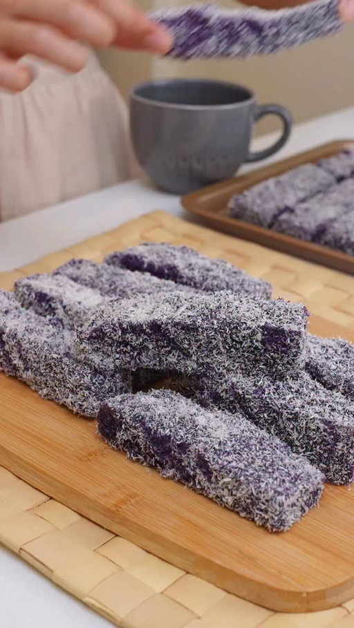 Hi bestfriend! Welcome to my Filipino Bakery Series — where we bake nostalgic Pinoy breads na siguradong magbabalik ng childhood memories mo. 🥹💜

Today’s episode: Ube Bars — the iconic bakery treat na soft, buttery, and coated in sweet ube syrup and coconut. Parang childhood merienda sa harap ng tindahan, but made fresh from your own oven! 😭🫶

🍰 Ube Bars Recipe:
• 170g Butter, room temp (around 3/4 cup)
• 200g White Sugar (1 cup)
• 313ml Fresh Milk (approx 1 1/3 cups)
• 512g All-Purpose Flour (around 4 cups)
• 2 tsp Baking Powder
• Pinch of Salt

Bake in a 9x13 inch pan at 350°F (180°C) for 40 minutes, preheated oven.

💜 Ube Syrup Coating:
• 300ml Condensed Milk (approx 1 1/4 cups)
• 2 tbsp Ube Flavoring or Extract
• 60ml Water (1/4 cup)
• 200g Desiccated Coconut (about 2 cups), for coating

✨ Once the cake is baked and slightly cooled, slice into bars. Dip each bar into the ube syrup, then roll generously in desiccated coconut. 

Let’s bring back all the bakery vibes — one purple bite at a time 💜

#FoodieFred #HiBestfriend #FilipinoBakerySeries #ubeBars #ubelamington