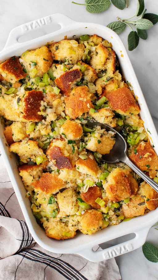 My Thanksgiving stuffing recipe starts features a few of my favorite things: sweet leeks, crusty sourdough, and loads of fresh herbs. 

PS: This stuffing recipe is this month’s Cooking Club challenge! Make it anytime during the month of November for your chance to win a Whole Foods gift card. More details in my “cooking club” highlight.

Ingredients
* 1 small loaf (1 pound) day-old crusty sourdough bread
* ½ cup salted butter, plus 1 tablespoon melted butter for topping
* 2 leeks, halved, thinly sliced, and rinsed well (2 cups)
* 4 celery stalks, diced (1¾ cups)
* 3 garlic cloves, chopped
* ¾ teaspoon sea salt
* ½ teaspoon freshly ground black pepper
* ¼ cup chopped fresh sage
* Heaping ¼ cup chopped fresh parsley
* 1 teaspoon chopped fresh rosemary
* 1 teaspoon fresh thyme leaves
* 1½ to 2 cups vegetable broth
* 2 large eggs, beaten

Instructions
* Preheat the oven to 350°F and grease an 8x11 or 9x13-inch baking dish. 
* Tear the bread into 1-inch pieces and place in a very large bowl. 
* Melt the butter in a large skilletover medium heat. Add the leeks, celery, garlic, salt, and pepper, and sauté for 5 minutes, turning the heat to low halfway through. Pour the leek mixture over the bread and sprinkle with the sage, parsley, rosemary, and thyme. Use your hands to toss until coated. Pour 1½ cups of the broth evenly over the stuffing and toss to coat. Add the eggs and toss again. The bread should feel pretty wet. If it’s still a bit dry, mix in the remaining ½ cup of broth. The amount you use will depend on how dense and dry your bread was. 
* Transfer the mixture to the baking dish. If making ahead, stop here, cover the dish with foil, and store in the refrigerator until ready to bake. 
* When ready to bake, drizzle the 1 tablespoon melted butter on top and bake, covered, for 30 minutes. If the stuffing is still pretty wet, uncover the dish and bake for 5 to 10 more minutes to crisp the top a bit 
https://www.loveandlemons.com/stuffing-recipe/

#stuffing #thanskgivingrecipes #easyrecipes #loveandlemons