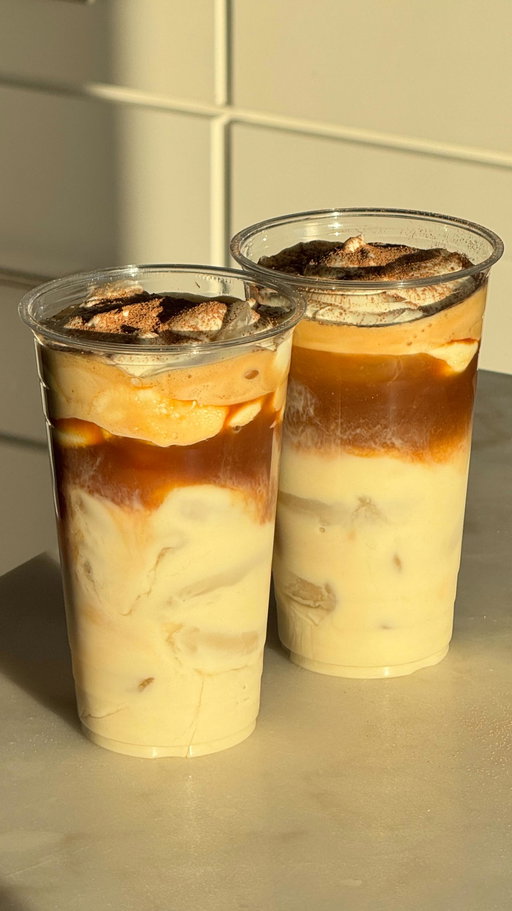 One for me & one for my work bestie ✨

 Recipe:
1. Grab two large cups. 
2. Fill both with ice, a splash of vanilla syrup, and 2/3 cup milk.
3. Brew one shot of espresso for each drink.
4. In a separate container, add 2 heaping tbsp marscapone cheese, 4 tbsp heavy whipping cream, and 1 tbsp vanilla syrup. Whisk until thick and well combined using an electric whisk. Divide evenly between each drink.
5. Top each drink with a light dusting of cacao powder.
6. Grab your bestie and enjoy!!!

#coffee #icedcoffee #tiramisu #tiramisulatte #icedlatte #coffeevibes #coffeeholic #homecafé