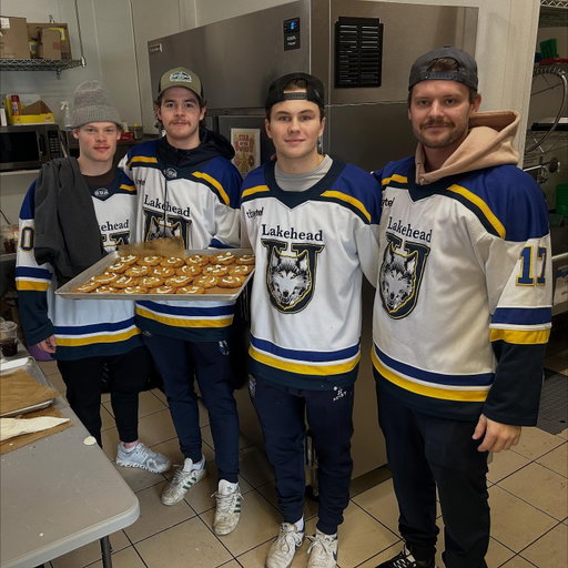 Our players spent the morning at Tim Hortons helping out with Smile Cookies — supporting local charities and giving back to the community that supports us every game. 🍪 💙 #HearTheHowl