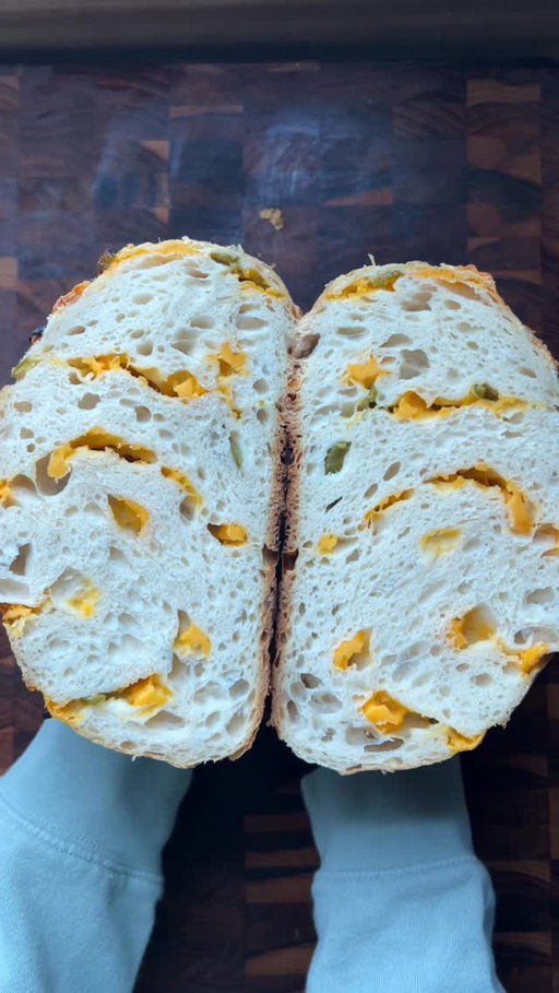 I accidentally added 170 grams of starter to my sourdough instead of my usual 100… and honestly?

Best. Mistake. Ever.

The rise was insane, the flavor was so much deeper, and the crumb? I AM OBSESSED.
Between the extra starter and doing two full minutes of stretch + folds every 30 minutes, this loaf might be my new favorite.

Here’s my updated “basic” recipe for two loaves:

720 grams water

170 grams sourdough starter

20 grams salt

1000 grams unbleached white flour

Mix everything together.
Cover and stretch + fold every 30 minutes (4 rounds).
I usually do this before bed and let the dough proof overnight on my counter, covered.
In the morning, refrigerate for 6 hours.

Heat your Dutch oven with the lid on for one hour at 450°F.
Divide the dough (I add inclusions right before baking).
Bake for 30 minutes with the lid on.
Remove the lid and bake for another 15 minutes.
Let cool completely before slicing. Torture, but worth it!

I’m filming a full YouTube video soon so you can follow along step by step. Stay tuned!

Have you made sourdough yet?
