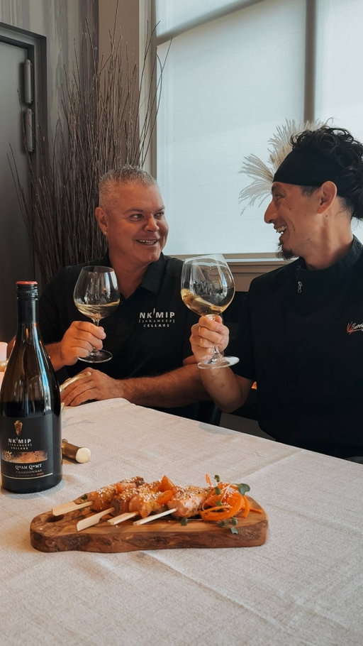 Water is life and for many Indigenous communities, salmon has long been a gift of that life.
⠀
Our third recipe in the 𝑮𝒂𝒕𝒉𝒆𝒓 series honours that connection with something simple, seasonal, and deeply satisfying: Sweet Water Skewers — maple-glazed salmon bites served warm and paired with our 2022 Qwam Qwmt Chardonnay.

Crafted by Nk’Mip Cellars Estate Winemaker Justin Hall and Chef Sean from Sweetgrass Kitchen, this pairing brings together water, land, and story — a reflection of balance on the plate and in the glass.

With gentle oak, minerality, and richness, this Qwam Qwmt Chardonnay was made to meet salmon on the table.

🐟  Sweet Water Skewers
Ingredients:
• 250g salmon fillet, cut into 1-inch cubes
• 2 tbsp maple syrup
• 1 tsp Dijon mustard
• 1 tsp soy sauce
• Toothpicks or mini skewers
• Optional garnish: sesame seeds or microgreens

Instructions:
Mix maple syrup, mustard, and soy sauce.
Coat salmon cubes in glaze.
Bake at 400°F for 8–10 min or pan-sear until just cooked.
Garnish as you like. Serve warm.

✨ Pair with Qwam Qwmt Chardonnay — crisp, layered, and ready to complement every bite.

Indigenous salmon recipe, Qwam Qwmt Chardonnay, simple wine pairing, Gather recipe series, BC Chardonnay pairing, salmon appetizer idea, Nk’Mip food and wine