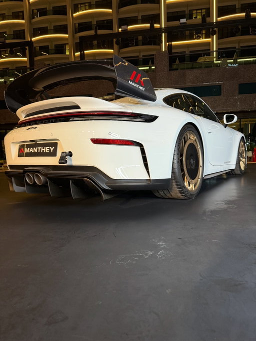 Porsche offers a @manthey_racing kit for the current 911 GT3 (992.2) for even better performance on the racetrack. The kit provides significantly more downforce and, as a result, increased cornering speeds. The suspension has been specially adapted for track use and the brakes are designed for the particularly high demands of track days. The new Manthey Kit was developed in close collaboration between the Porsche Development Centre in Weissach and the Manthey engineers in Meuspath.

The aerodynamics of the 911 GT3, which are already designed for high downforce as standard, have been further optimised for track use. The entire underbody has been transformed into a continuous aerodynamic element. The air deflector elements on the underbody (also known as turning vanes) have been extended by one metre, to 1.5 m. This enables them to generate additional downforce in a particularly efficient manner. In addition, the luggage compartment floor of the production vehicle now has a cover, creating a completely smooth underbody.

Together with Manthey, Porsche has developed a special four-way coilover suspension for the 911 GT3 that can be adapted for circuit use. The suspension struts are four-way adjustable, and the rebound and compression can be adjusted without tools. The moderately adjusted spring rates (plus 10 per cent on the front axle compared to the predecessor model with the Manthey Kit) contribute to improved handling at the limit and are adapted to the significantly higher downforce values. The optimised circuit suspension increases mechanical grip and makes the car even more stable, especially when driving over kerbs.

#992gt3 #gt3 #mantheyracing #porsche #porschecolorado