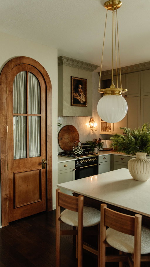 I’ve had the vision of this door for years now and it’s been amazing seeing it come to life. It’s just what this kitchen needed and is a statement on its own. Also, so glad I went with the decision to do the fabric behind glass instead of a solid door. The natural linen fabric matches the cabinets so well, and the pleats in it tie in with the fluting around the island. It came out even better than I imagined!