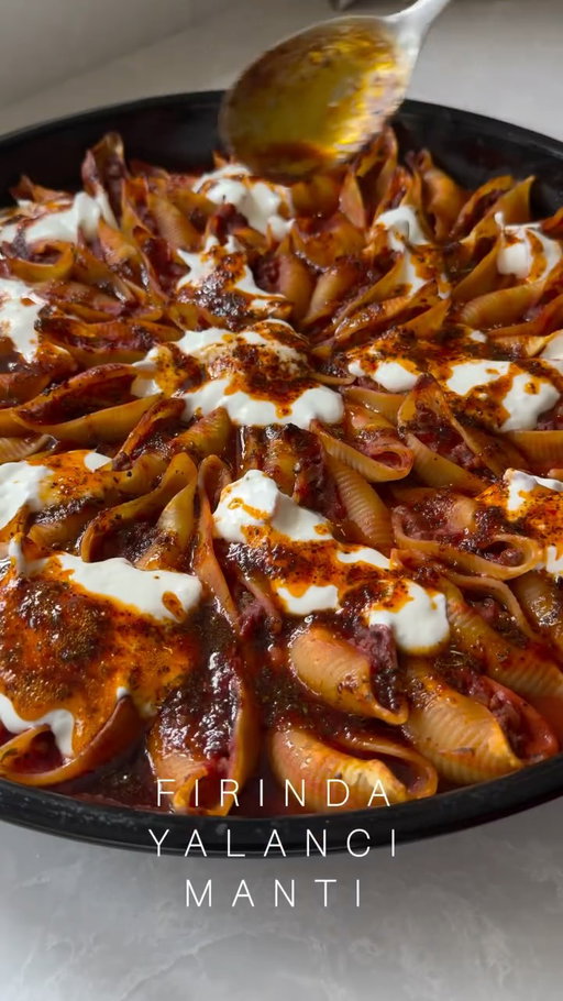Ok, let’s make it Mutti @muttipomodorouk with this showstopping, crowdpleasing “Fırında Yalancı Mantı” - Stuffed Oven Baked Pasta Shells with Garlic Yoghurt and Pul Biber Butter 🍝🌶️🌿 a feast for the eyes, perfect for feeding a crowd, and one to definitely impress your guests with. I’ve used the luscious Mutti Polpa, richly intense Double Concentrate Tomato Purée and deliciously smooth Passata and have listed tips for making it advance for hosting a crowd on my blog. The full recipe is on my blog, please make it. ad 

Serves 6-8

3 tbsp olive oil
2 onions, finely chopped
1 tsp salt
1 tsp finely grated garlic 
1 tsp ground cumin
1/2 tsp ground cinnamon
1 tsp pul biber 
1 tsp dried mint 
1 tsp paprika
2 tbsp Mutti Double Concentrate tomato purée
500 g minced lamb / beef / meat-free mince 
1 x 400g can Mutti Polpa 
½ tsp ground black pepper
2 bay leaves
100ml milk 
500g Conchiglioni pasta, cooked al dente 
1 x jar Mutti Passata 
500ml chicken / vegetable stock 

For the garlic yoghurt
1 large garlic clove, finely grated
150 g (5½ oz) natural yoghurt
½ tsp sea salt flakes 

For the chilli butter
50g unsalted butter
1 tbsp extra virgin olive oil
1 tbsp Mutti Double Concentrate tomato purée 
1 tsp pul biber
1 tsp dried mint

#melizcooks #MakeItMutti #DeceptivelySimple #pasta #yalancımantı