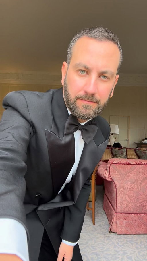 Trying on the tux for the holidays — because the season deserves a little extra elegance.  Here are my hot tips for Dressing Up in a Tuxedo for the Festive Season:
• Prioritise tailoring
A well-fitted tuxedo transforms everything. Shoulders clean, sleeves just right, trousers tailored to the shoe.
• Choose your lapel wisely
A peak lapel feels bold and festive; a shawl collar offers a softer, more elegant presence.
• Keep the shirt crisp
A white dress shirt with a structured collar is non-negotiable. Pleated or plain—both work beautifully.
• Add a festive touch, subtly
A velvet bow tie, a silk pocket square, or a rich-textured jacket elevates the holiday mood without going overboard.
• Don’t forget polished shoes
Patent leather or well-shined Oxfords complete the look. Clean lines matter.
• Perfect the finishing details
Cufflinks, a refined fragrance, and minimal accessories show intention without excess.
• Confidence is the key piece
No matter the style choice, the tuxedo shines only when the wearer feels at ease in it.