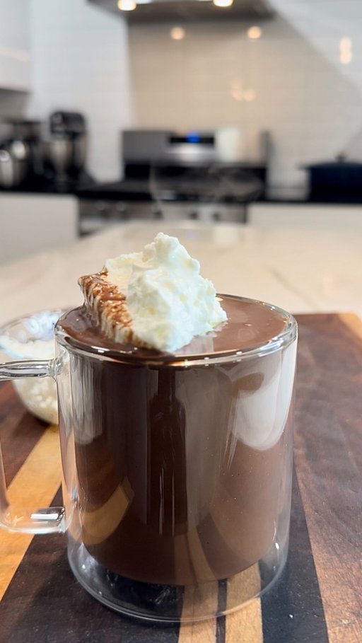 If you make hot chocolate with water… you’re choosing to struggle on purpose. Seek warmth immediately. And for the record, this French-style version goes all the way back to 1600s Paris before it made its way to the U.S. through traveling chefs. ☕️ 🔥🤌🏾

Homemade French Hot Chocolate

Ingredients
9 oz high-quality 70% dark chocolate, finely chopped
1 cup heavy cream
1 cup whole milk
1 tbsp sugar (more if you like it sweeter)
Tiny pinch of salt
1 shot espresso (optional, but incredible)
½ tsp vanilla bean paste
Homemade whipped cream (see note)
Extra chocolate for shaving

Instructions
In a saucepan over medium heat, combine the heavy cream, whole milk, sugar, salt, and espresso. Whisk gently as it warms — you want it steaming with tiny bubbles around the edges, but do not let it boil.

Once the mixture is hot, turn the heat down and add the chopped chocolate. Whisk until it melts completely and becomes thick, glossy, and smooth.

Stir in the vanilla bean paste, then finish by folding in a generous spoonful of homemade whipped cream to give it that classic French richness.

Pour into your favorite mug and top with more whipped cream.
For presentation, shave a little dark chocolate over the top.

Homemade Whipped Cream:
Whip 1 cup cold heavy cream + 1 tbsp sugar + splash of vanilla until soft peaks form.

You can use a hand whisk, hand mixer, or stand mixer — all three work. Just keep the cream cold for the best texture.

#hotchocolate #chocolate #drinks #homemade #food #foodies #foodstagram #instafood #foodlover #recipe