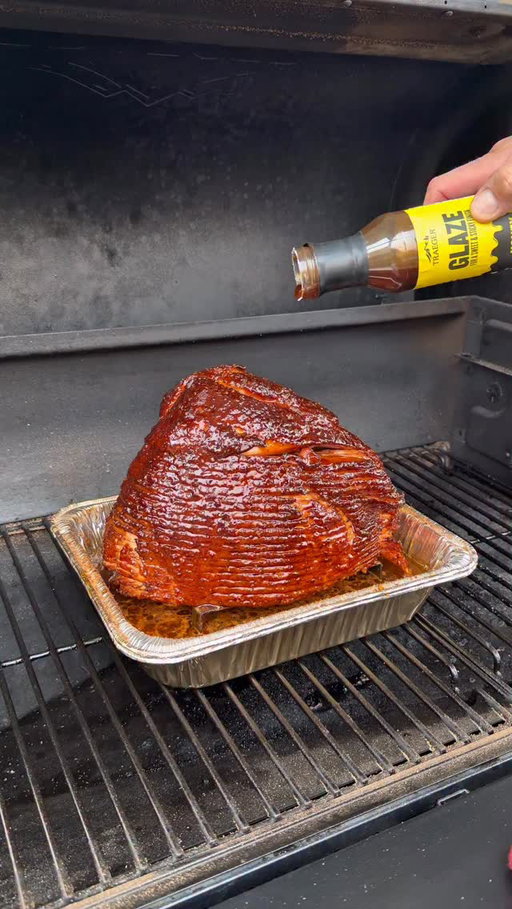 The easiest way to upgrade your holiday ham? Double smoke it on a Traeger.

We start with a spiral cut ham, coat it in mustard, load it up with Traeger Whiskey Dusk, and let that wood-fired flavor sink in. Let the Traeger roll at 225 °  until it hits an internal temperature of 135 °. 

Next, brush on that Honey Brown Sugar Glaze until it turns glossy, sticky, and absolutely perfect. Slice through those spiral cuts and every edge bite hits with sweet, smoky Traeger goodness.

Simple. Foolproof. Game-changing.

Try double-smoking your holiday ham once and you’ll never do it any other way.

#Traeger #traegernation #traegerhood #holidayham