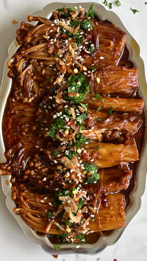 5 Ingredient Garlic Soy Enoki Mushrooms 🍄‍🟫

This is 555 - a series where I’m sharing 5 ingredient recipes, 5 days a week, for 5 weeks!

Recipe 20 is my garlic soy enoki mushrooms that are fiery, sweet and packed with umami. With a juicy “meat-like” texture and dripping in a rich sauce, they are perfect served as a side dish, with rice or in bao buns. 

👉 Comment “ENOKI” and I’ll DM you the recipe, or grab it off my website link in my bio!

#555 #5ingredientrecipes #easyrecipes #enokimushrooms #mushroomrecipe #garlicsoy #appetiser #veganrecipes