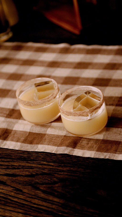 Inspired by the new Khloud Cinnamon Roll popcorn, the Cinna Swirl cocktail is made with warm cinnamon and smooth reposado for a cocktail that feels like dessert reinvented. 

Video by @yellowbellykelly 

RECIPE:
- 1.5.OZ Cinnamon-infused 818 Tequila Reposado
- 1 OZ Lemon Juice
- 0.5 OZ Maple Syrup
- 1 Egg White 
- Royal Icing and Cinnamon Sugar (for rim)
 PREP:
To make the Cinnamon-Infused Reposado:
1. Pour 1 cup of 818 Reposado into an airtight container with 4 cinnamon sticks.
2. Let sit at room temperature, shaking occasionally, for 4 hours. 
3. Strain out the cinnamon sticks.
 To make the cocktail:
1. Gently pipe the rim of an upside down rocks glass with royal icing. Sprinkle cinnamon sugar over the iced rim until covered. Let sit, upside down, in the freezer until ready to drink. 
2. Combine all cocktail ingredients in a shaker and dry shake vigorously. 
3. Add ice and shake until shaker tin is frosty. 
4. Fill the prepared rocks glass with a large ice cube. 
5. Strain the cocktail into the glass and garnish with a cinnamon stick!