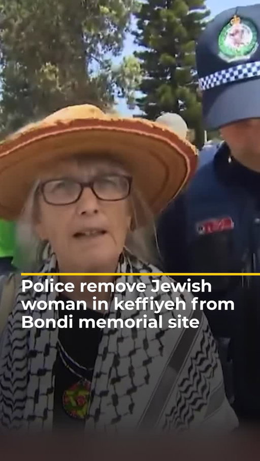 Australian police removed Jewish activist Michelle Berkon from the Bondi Beach memorial site after she wore a keffiyeh while mourning victims of the mass shooting. ⁠
.⁠
Berkon says the tragedy was politicised, with Israeli flags turning a space for grief into a political statement.⁠
.⁠
#Australia
