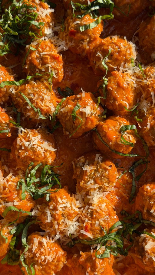 VODKA SAUCE MEATBALLS 
Vodka sauce meatballs - the easiest protein-packed appetizer that still feels fancy!!! ✨ Using @simeks Original Meatballs keeps it simple, but the vodka sauce makes it feel special. Perfect for holiday hosting when you are looking to add some protein + substance to your spread! 👏🏼
INGREDIENTS
* 1 (22 oz) bag Simek’s Original Meatballs
* 2 tbsp olive oil
* 2 tbsp butter
* 1 shallot, finely diced
* 3–4 garlic cloves, minced
* 1 tsp salt
* 1 tsp black pepper
* 1 tsp dried oregano
* 4 oz tomato paste
* 1–2 tbsp Calabrian chilis (adjust to taste)
* 1/4 cup vodka
* 3/4 cup heavy cream
* 3/4 cup freshly grated parmesan cheese
* Parmesan cheese & fresh basil to garnish
DIRECTIONS
1. Prepare the meatballs according to the stovetop directions in a large skillet. Once they are cooked through, remove from the skillet & set aside, along with the remaining water
2. In the same skillet, add olive oil and butter. Once melted, add the shallot and cook for 2–3 minutes until softened. Stir in the garlic, salt, pepper, and oregano and cook for 30 seconds until fragrant.
3. Add the tomato paste and Calabrian chilis. Cook for 2–3 minutes, stirring frequently, until the paste deepens in color and begins to caramelize.
4. Carefully pour in the vodka and simmer for 1–2 minutes, allowing the alcohol to cook off.
5. Lower the heat and stir in the heavy cream & parmesan cheese and mix until the sauce is thick, glossy, and well combined.
6. Return the meatballs to the skillet and gently toss to coat. 
7. Garnish with parmesan cheese & fresh basil and enjoy!