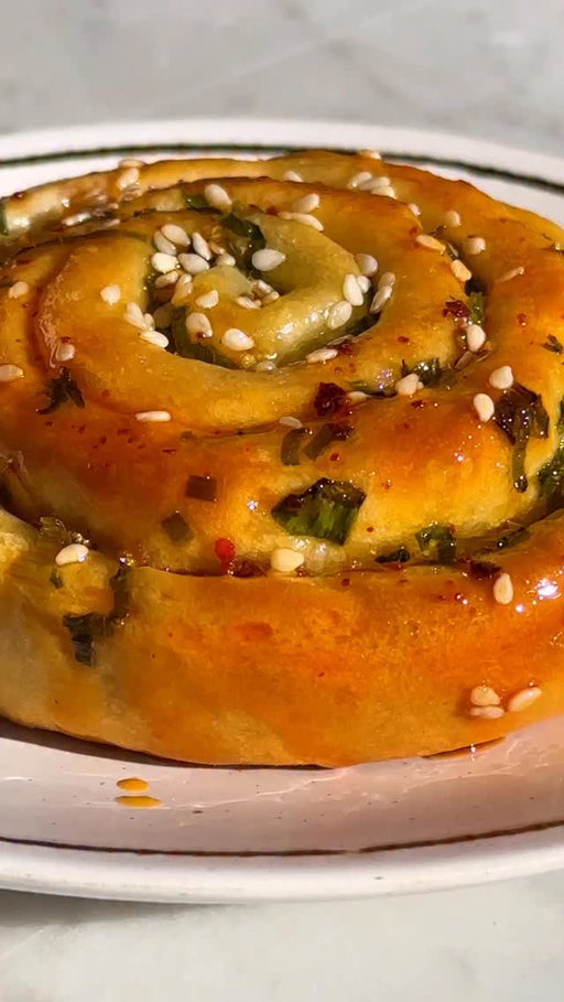 Morning buns 🤝 scallion pancakes. Break out the chile oil for dipping and get @genevieve_ko’s free recipe at the link in bio.