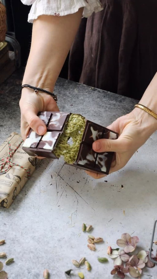 It’s the season of giving, and homemade sweets are often my gift of choice. This homemade Dubai Chocolate is a beloved fan favorite, so much so it was nominated for the TikTok Awards this year! Making it homemade is well worth it, especially with quality ingredients, and I’m sure your family and friends will love it.
 
Dubai Chocolate
 
Ingredients:
1 1/2 cups kataifi
1 tbsp peanut oil (optional)
1 heaping cup (320g) pistachio cream
1/4 cup crushed pistachios (optional)
250g high quality chocolate (66% cocoa or to your preference)
 
Instructions:
Using a sharp knife, cut the kataifi into small pieces as in the IG reel. Add into a medium pan over low heat, toast the kataifi slowly, stirring occasionally. When the color becomes a light golden, add peanut oil (optional) and continue to toast until crisp and golden brown. Set aside.
 Melt the chocolate over a bain marie. Remove from the heat and let sit while mixing the kataifi mixture.
 
Once the kataifi is room temp, add into a medium bowl with the pistachio cream and crushed pistachios. Mix together until fully combined.
 
Pour the melted chocolate into the mold, tilt to coat the bottom and sides, and then flip over to allow the excess to drip out. Immediately place into the freezer for around 10 minutes just until set. If the chocolate looks too thin, repeat this process one more time on top of the first layer of chocolate.
 
Divide the kataifi mixture in two and spread evenly over both sides of the chocolate bar. Pour the remaining chocolate over the top and use a straightedge to smooth the surface. Return to the freezer for 10 to 15 minutes until set.
 
Carefully remove from the mold and wrap with parchment paper. Serve immediately or store in the fridge. Let sit at room temp for a few minutes before serving.
 
Bon appetit!