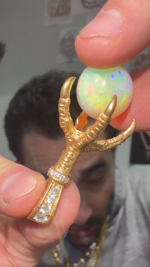 24k eagle claw grasps a spherical opal. 70966 on Traxnyc.com