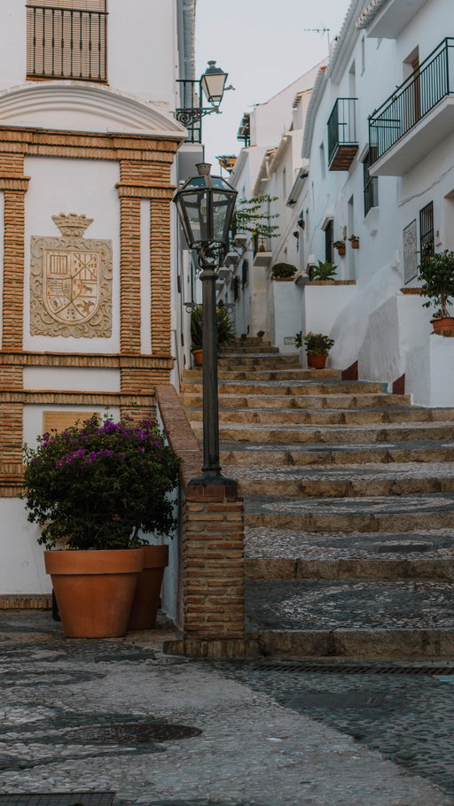 And you have never heard of it before!👇🏼

✨FOLLOW @sinahsstories for more underrated travel inspo, guides & itineraries!

Let me tell you a secret: I had never heard of this town either before we decided to visit it.

📍Crowned the most beautiful village in Spain by the Spanish Association of Rural Tourism in 2016 and ABC Andalucíaas the most beautiful town in 2024, Frigiliana truly is a picture perfect postcard town.

And here are the most important facts:

✨Location:

Frigiliana is situated in the province of Málaga, Andalusia, Spain, offering a scenic escape nestled amidst the mountains of the Costa del Sol.

🌿What to do there:

Wander through the enchanting streets adorned with traditional whitewashed houses adorned with colorful flowers, and experience the authentic ambiance of Andalusian architecture. Also visit some of the breathtaking viewpoint like my favorite, the Mirador de Santo Cristo.

☀️When to go:

If you want to avoid the heat, then go between April to early June or September to late October. However, we were there in July and found that even in the height of summer, it wasn't overcrowded.

✨Hi, I’m Sinah and I love sharing Europe travel tips that are actually useful: the little underrated spots, easy ways to see a place, and the kind of things that make a trip feel magical, plus guides and itineraries that help you explore the places. FOLLOW along for more!