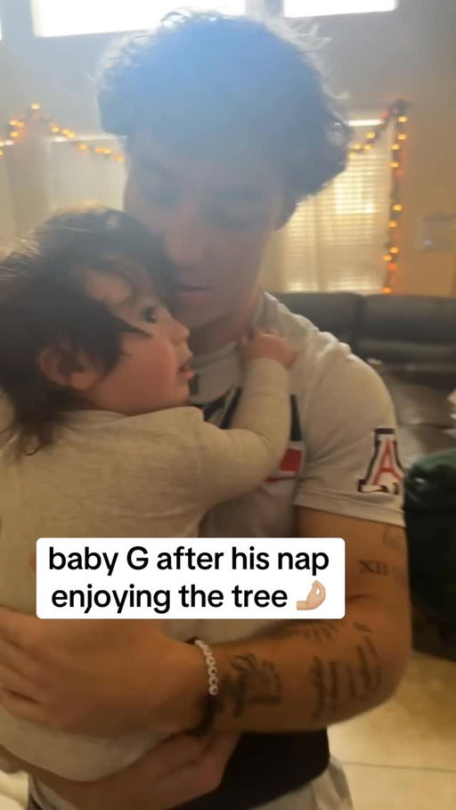 baby G enjoys the christmas tree 🤌🏼 #babyG #arizonabaseball #slumped