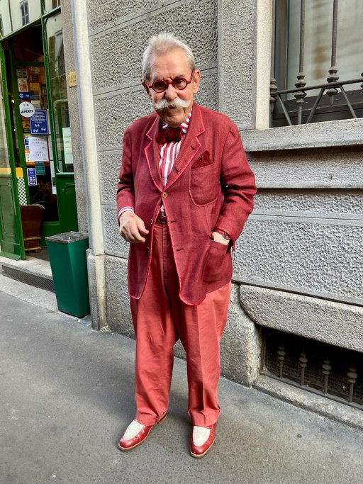 We have lost a legend. I am so sorry to share that Signore Italo Manca, arguably the most stylish man in Milan, passed yesterday. He was the dapper proprietor of one of my favorite restaurants La Libera, in Brera. After quite a few years seeing him there, running the dining room in the evenings in his iconic colorful tailoring, I felt I had to ask if I could take his photo. His looks and his joy in dressing were just too incredible, too singular not to record. He was always happy to oblige and I tried to converse in my very broken, rudimentary Italian, sharing my admiration for his style. Here are just a few of his legendary looks. Condoglianze.
