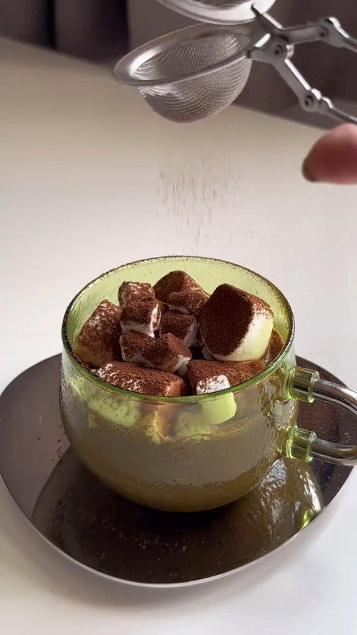 Hot cocoa + marshmallows, feeling so warm and cozy altho in Malaysia is summer all year, this still hits different cause is Christmas 🎄

Recipe:instructions: 
-add in 300ml milk into the pan (boil in medium heat) 
-add 2 tbsp of cocoa powder 
-1 cinnamon stick (for some kicks and enhance the choco flavour 🙊) 
-1 tbsp sugar (stir using any weapon, I’m using whisk to make sure cocoa and sugar is dissolve) 
-then add some couverture chocolate chip (54%) into the mixture 
-keep stirring and strained it 
-add some mini marshmallows or big marshmallow

Make this for someone you love (or yourself, no judgment 😌)
Merry Christmas 🎄✨

#hotcocoa #hotchocolate #christmasdrinks #cozynights #repost