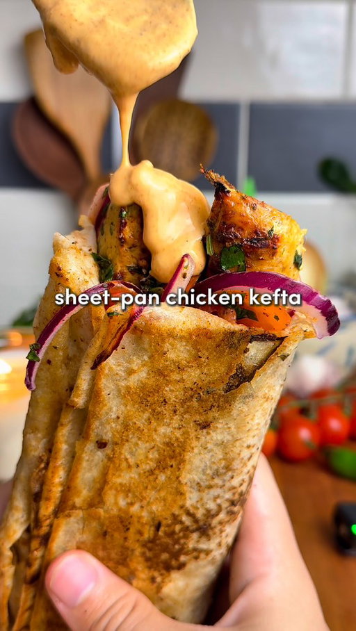Top 3 Recipes of 2025: Sheet Pan Chicken Kefta Wraps 🔥

For all of you asking - the app link for Osta is in my bio or you can search “Osta Recipes” on the App Store or Google Play store ‼️🫶

Comment “Recipe” and I’ll send you the  full recipe card for free!!

For the Chicken Kefta:
-1.5–2 lbs ground chicken (700-900 g)
-2 tbsp tomato paste
-8 garlic cloves, minced
-2 tsp smoked paprika, 2 tsp cumin, 2 tsp salt, 2 tsp black pepper, 1 tsp turmeric, 2 tsp garlic powder
-1/3 cup fresh parsley, chopped
-1/3 cup fresh cilantro, chopped (optional)
-1 large or 2 medium yellow onions, grated + squeezed dry*
-On top before baking: 4 tbsp olive oil
For the Roasted Garlic:
-2 garlic heads, 1 tbsp olive oil and 1 tsp salt
For the Fresh Salad:
-1/2 large red onion, thinly sliced
-1 cup cherry tomatoes, quartered
-1/4 cup fresh parsley, chopped
-1 tsp salt, 1 tsp pepper & 2 tsp sumac
-Juice of 1/2 lemon
Roasted Garlic Paprika Sauce:
-Roasted garlic cloves, 1/4 cup mayo, 1/4 cup Greek yogurt, juice of 1/2 lemon, 1 tsp paprika + 1 tsp pepper

1. Preheat oven to 400°F (205°C). Slice the tops off two garlic heads, drizzle with olive oil and salt, wrap in foil, and roast for 45–60 minutes until golden and soft. While the garlic roasts, prep the kefta.
2. Grate the onion, squeeze out all liquid with paper towel or cheesecloth. (This prevents watery kefta.) In a large bowl, combine chicken, tomato paste, minced garlic, spices, parsley, cilantro (if using), and the grated onion. Mix with your hands for 2–3 minutes until sticky and well combined.
3. Spread onto the sheet pan in a 1/2-inch (1.25 cm) thick rectangle. With a knife, score into 1-inch strips (2.5 cm). Drizzle evenly with 4 tbsp olive oil.
4. Bake for 12–15 minutes, then broil 2–5 minutes until golden and slightly crisp on top.
5. While baking, toss onion, tomatoes, parsley, salt, pepper, sumac, and lemon juice in a bowl.
6. Squeeze roasted garlic cloves into a bowl, mash, then mix with mayo, yogurt, lemon juice, paprika, and pepper until smooth.
7. On lavash or pita, slather sauce, add 1–2 strips of chicken kefta, top with salad. Roll tight. For extra magic, crisp the wrap in a lightly oiled skillet for 1-2 mins per side.