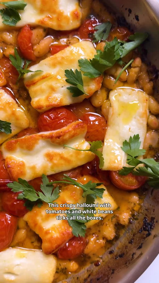 Crispy halloumi, juicy cherry tomatoes with white beans and crusty bread — what more could you ask for? Link in bio to get @mymoroccanfood’s recipe (for free)!
