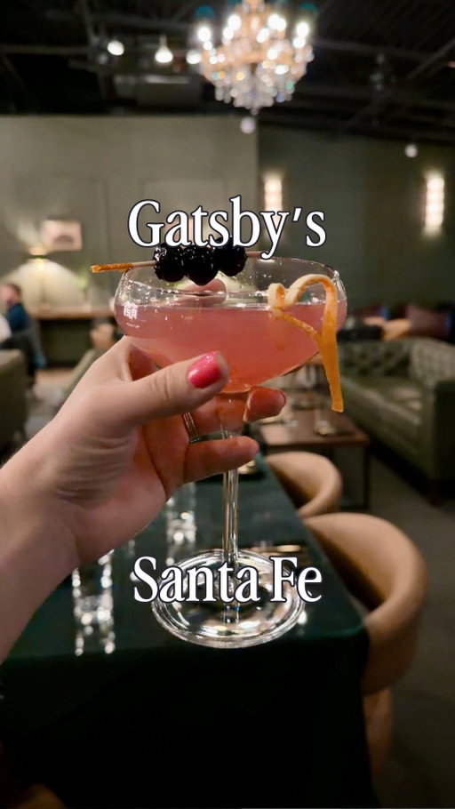 There is a new swanky spot in the Santa Fe Railyard, and it’s perfect for a classy night out. 

I went to Gatsby’s Restaurant & Cocktail Lounge for the first time on a Friday night a few weeks ago and immediately loved the vibe. @gatsbysnm has a softly-lit speakeasy atmosphere that feels cozy and elevated, and the champagne on entry sets the tone perfectly.

Their menu had a great range, and they have an impressive selection of spirits. Their drink menu includes the classics, a list of signature cocktails, wines by the glass, and even a one-hundred-dollar margarita if you are feeling really bougie!

A member of their staff gave me a tour, and I got to peek into the private rooms with balcony access that you can rent. They would be perfect for nights when concerts are happening in the Railyard, and you want your own spot with a view.

I ordered the Daisy Kiss, and it was precisely the kind of cocktail I love, so I ordered a second one. James had a dirty martini and said it was the best he had ever had. We shared the truffle fries, the street tacos, and an impressively sized and tasty tuna tartare. Every single thing was so so good.

Their daily happy hour runs from 4:00 pm to 6:00 pm, with three cocktails discounted to $10 each and 20% off the entire food menu. They have live music on Fridays starting at 6:00 pm, and musicians were setting up as we were heading out, so I want to go back and experience it next time! They also have late hours and a late-night menu offered, which is always exciting!

We will definitely be back! #GatsbysNM #SantaFeRailyard #SantaFeNewMexico