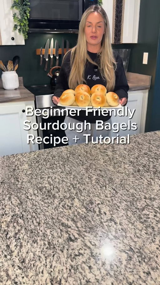 🥯 ORIGINAL PLAIN SOURDOUGH BAGELS

INGREDIENTS:
• 464g water
• 332g active starter
• 1,112g bread flour (or high-protein AP)
• 55g turbinado sugar
• 55g maple syrup
• 22g salt

METHOD:
1️⃣ Mix water + starter, then add maple syrup, sugar, flour, and salt. Mix until shaggy.
2️⃣ Knead briefly, shape into a ball, cover, and rest 1 hour.
3️⃣ Knead again, reshape, return to bowl seam-side down, and bulk ferment until doubled (about 6–12 hours).
4️⃣ Let dough release naturally, divide into 12 pieces (~170g each), and shape into tight balls.
5️⃣ Cover and rest 20 minutes.
6️⃣ Poke a hole in each ball and gently stretch into bagels.
7️⃣ Final rise until soft and puffy (a few hours).
8️⃣ Preheat oven to 425°F. Boil water + add about 50g honey. Boil bagels 30 seconds per side.
9️⃣ Place on parchment-lined sheet and bake 15–18 minutes until golden and glossy.
🔟 Cool at least 1 hour before slicing (don’t be cutting early then calling them “gummy”).