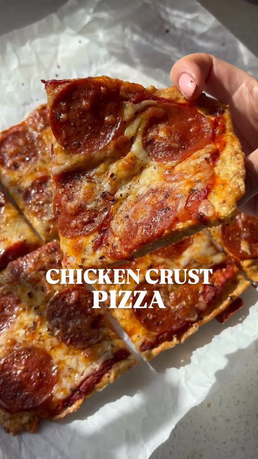 My most viral recipe of 2025 and potentially why you’re here - my Chicken Crust Pizza with 176g of protein for the entire pizza 🍕

If you want more high protein dinner recipes comment “recipe” for my 35 High Protein Dinner Recipes Ebook (all with macros)!!! This ebook is loaded with all my favourite high protein recipes that helped me lose 20lbs in 2025 and keep it off!!

This recipe is a protein cheat code!! While also satisfying your pizza cravings 🤤

INGREDIENTS -
CHICKEN CRUST
450g ground chicken
2 large eggs
1/2 cup grated parmesan cheese
1 tsp garlic powder
1 tsp italian seasoning
1/2 tsp salt
1/2 tsp black pepper

TOPPINGS
1/2 cup pizza sauce
1 cup grated mozarella cheese
20 turkey pepperoni slices

DIRECTIONS -
1) Set your oven to 400°F and line a baking sheet with parchment paper.
2) In a large bowl, mix together ground chicken, eggs, parmesan, garlic powder, Italian seasoning, salt, and black pepper until fully combined.
3) Transfer the chicken mixture onto the prepared baking sheet and press it into a thin, even circle or rectangle. You want it thin or else it will have a hard time getting crispy. 
4) Pop it in the oven for 25 minutes, or until golden and firm. Let it rest for 5 minutes to set.
5) Crank the oven up to 425°F. Spread on your favorite pizza sauce, cheese, and toppings.
6) Bake for another 10 minutes, until the cheese is melty and bubbly.
7) Let it cool slightly, then dig in and enjoy every crispy, cheesy bite!

#highproteindinner #highproteinpizza #proteinpizza #chickenpizza #chickencrustpizza 

https://bails.thrivecart.com/35-high-protein-dinner-recipes-ebook/