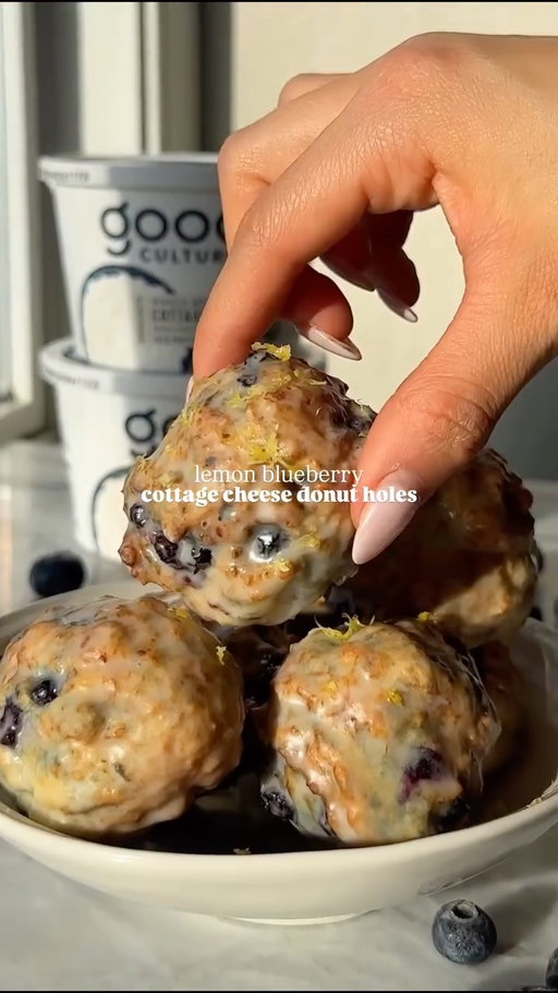 #GoodCulturePartner Officially obsessed with these *lemon blueberry cottage cheese donut holes* 🤤 they are perfectly sweet, fluffy, and contain 5 G of protein per donut hole made using @good_culture cottage cheese. 

Serving size - 6 donut holes

Ingredients
* ¾ cup Good Culture 4% Cottage Cheese, blended until just smooth
* 1 cup flour (may need to 1-2+ tbsp additional flour if using a cottage cheese brand with thinner consistency or lower fat) 
* 1 egg 
* 1 tbsp maple syrup 
* Zest from 1 lemon 
* 2 tsp baking powder 
* ¼ tsp baking soda 
* ¼ tsp salt
* ⅓ cup frozen wild blueberries

Icing 
* ½ cup powdered sugar
* ¼ tsp vanilla 
* 1-2 tbsp milk 

Directions
1.  In a large mixing bowl, whisk together flour, lemon zest, baking powder, baking soda, and salt. Add the blended Good Culture cottage cheese, egg, and maple syrup and stir well with a spoon. Once it starts to come together, fold in blueberries.

2. Take ~2 tbsp dough at a time and carefully roll into balls. 

3. Preheat air fryer, coating the basket with non-stick cooking spray. 

4. Place balls in air fryer, trying not to overcrowd the basket. Spray with non-stick cooking spray. Air fry for 6-8 minutes at 350F. 

5. Remove from air fryer and cool. While donuts are cooling, whisk together the ingredients for the icing. 

6. Once donuts are cooled completely, dip them in the glaze and let set for ~10-15 minutes. Enjoy!

#cottagecheese #donutholes #highproteindessert