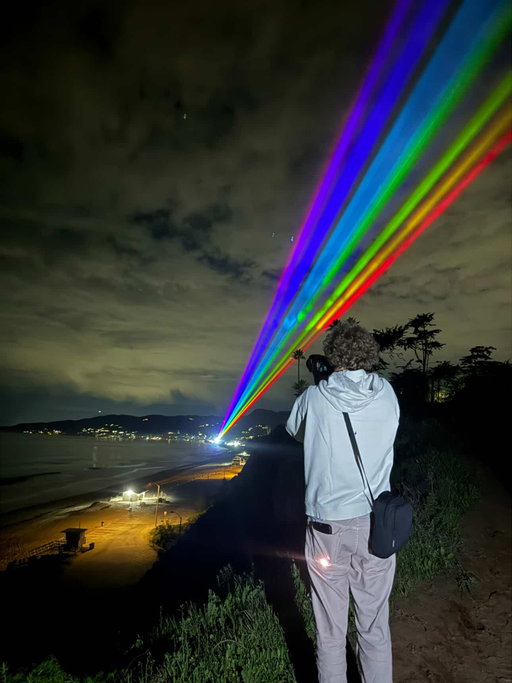 To mark the one-year anniversary of the Palisades Fire, artist Yvette Mattern ( @ymattern ) bathed Zuma Beach in a rainbow of laser beams. Titled ‘Global Rainbow,’ the one-night-only installation sought to act as a beacon of healing and hope, as well as a tribute to the 5,000-plus firefighters who used the Malibu beach as a base camp during the fire.

📸: @ymattern