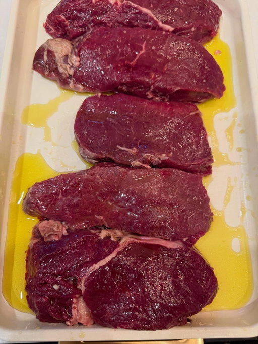 Elk steaks for dinner. 
Covered them in olive oil and @traegergrills blackened Saskatchewan rub.  Cooked it 225 until it got an internal temperature of 125 then finished it on a cast iron skillet. 
Served it with Kimchi.  It was delicious.