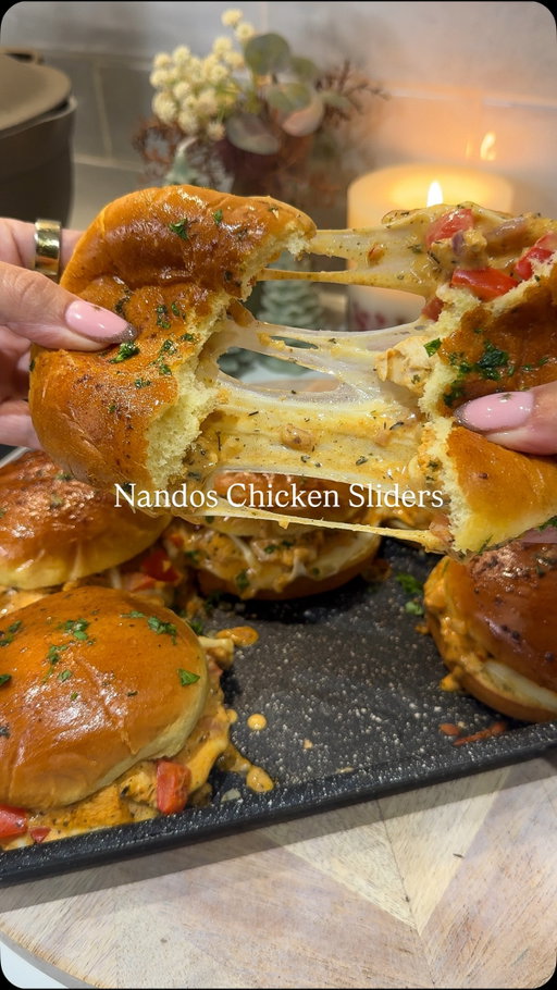 Top 5 Recipes of 2025 — No. 3 - Nandos Chicken Sliders 

This was SO good & literally the quickest dinner ever to make, genuinely less than 20 minutes 🙌🏼

Follow @kimberlys for more recipes like this⤵️

For the chicken 
- 300g chicken breast 
- 1 small diced onion 
- Half a diced pepper 
- 1 packet Nandos peri rub 
- 80g Philadelphia light 
- Tbsp Nandos peri peri medium 

To serve/toppings:
- 6 brioche rolls 
- 6 Mozzarella slices 
- 40g grated mozzarella

The garlic butter: 
- 20g butter 
- Tsp parsley 

Dice the chicken & mix with the rub, then fry this in a pan, once it has some colour add in the onion and pepper, cook for 5-6 minutes until the veg has softened and the chicken is cooked through. 

Add the Nandos sauce and Philadelphia to the chicken and stir well.

Layer the bottom of the brioche rolls in a baking dish, top with mozzarella slices, then the chicken mix and sprinkle over the grated mozzarella. Add the tops of the bread rolls, then lather over the garlic butter and pop in the oven for the cheese to melt and go all gooey. Around 10 minutes in total.