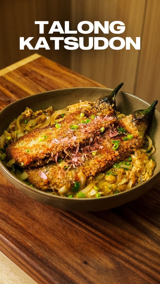 Talong Katsudon 🍆

I took the idea of katsudon and built it around one of my favorite Filipino ingredients, roasted talong. Breaded and fried until crisp, then finished in a sweet-savory katsudon sauce with onions and egg, all served over rice.

Most of the flavors here are Japanese, but that charred talong makes all the difference. It brings that smoky, familiar taste that instantly feels Filipino and keeps the dish grounded.

Crispy, saucy, and comforting in the best way. Tag someone who’d be down to try this mashup!