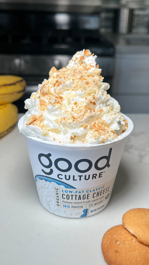 whipped. layered. gone. 

Banana Pudding Cottage Cheese Cup

Banana Pudding Base: 
•  1 Good Culture Single Serve Cottage Cheese Cup
•  2 tbsp vanilla protein powder 
•  1 tbsp maple syrup 
•  1/2 large ripe banana

Additional ingredients: 
•  4 small vanilla wafer cookies
•  Whipped cream for serving
•  Extra banana slices 

Method:
1. Add all banana pudding base ingredients to the cup of an immersion blender cup & blend until smooth and creamy. 
2. In the empty good culture cup, add a few banana slices at the base. Layer with 1/2 the pudding mixture, then 3 vanilla wafer cookies. Top with remaining 1/2 pudding mix. Cover and refrigerate for at least 1 hour (more for a softer cookie center).
3. Remove from fridge, top with whipped cream and an extra crushed vanilla wafer cookie & enjoy! 

Note: For a gluten free option, vanilla wafers can be subbed for GF vanilla Cookies or extra banana slices