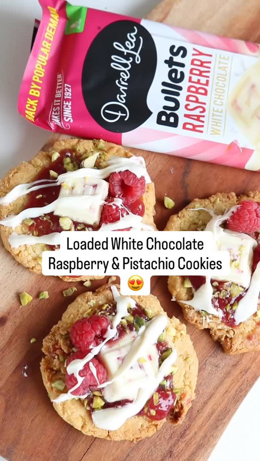 Happiness is… a cookie loaded with our White Chocolate Raspberry Bullets block and pistachios! 🍪💖​

Ingredients:​
🤍 2 Darrell Lea White Chocolate Raspberry Bullets Blocks (half a block chopped into small pieces)​
🤍 1 bag of cake mix ​
🤍 ½ cup melted butter​
🤍 2 eggs​
🤍 40g chopped pistachios​
🤍 20 fresh raspberries​
🤍 10 tsp berry fruit compote​

Method:​
 1️⃣ Mix the chopped chocolate, cake mix, eggs and melted butter together.​
 2️⃣ Place the mixture in the freezer for 10 minutes to set.​
 3️⃣ Use an ice cream scoop to place 10 balls onto a baking tray lined with baking paper.​
 4️⃣ Bake in a 180°C oven for 15-20 minutes until golden brown.​
 5️⃣ Decorate while hot with leftover chocolate (whole pieces and melted), pistachios, berry compote and fresh raspberries.​

#DLMakesItBetter #PalmOilFree #WhiteChocolate
