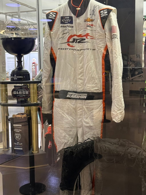 Momma I made it in the hall of fame - albeit for the second time. First time was my suit from winning Mid Ohio in 2022 - which led to me getting back full time and eventually the crazy night I used this suit. 

This one is too cool, because I was pretty convinced my time in NASCARs second series was always going to be a what-could-have-been. Never seeing the checkered flag first. 

Then the call came. Couldn’t believe @dalejr would ask me to do this but immediately I knew - we are going to win. 

And we did. 

Like many drivers, my biggest fan through my whole racing career has been my mom. The day after Daytona she went into the hospital fighting a chest infection (she’s fine now), so when I finally got back. We went to visit her and I brought the checkered flag with me -> swipe to see that photo. Apparently she couldn’t handle winning! 

I don’t know if I’ll ever run an Xfinity (now Oreily Auto Parts Series) race again. Which is fine. I was content before, but now after that win - I think of it as the greatest gift this sport has ever given me.

It’s a night I will never, ever forget. 

Thanks @dalejr and @connorzilisch for signing it and @nascarhall for making it even cooler.