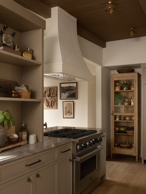 Excited to share the kitchen from our California Canyon Project.

To me, the kitchen is the heart of the home, so it was important that the palette and hardware felt warm and welcoming. We wrapped the cabinetry and ceiling in grounding @farrowandball tones to create a cocooned backdrop that feels calm and inviting.

With a smaller footprint, we thoughtfully reimagined storage through custom built-ins and deep drawers to bring in the functionality it was previously lacking. We then layered in a rustic wood cabinet as an open pantry to offset the clean cabinetry and add dimension with an old-world sensibility. Bronze hardware from @loandcointeriors was added to bring a subtle richness that anchors the space in craftsmanship.

A kitchen designed to feel used, loved, and truly lived in.

photos by @public311design