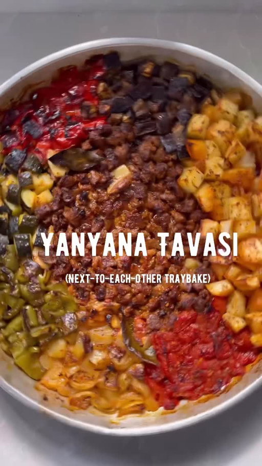 Yanyana Tavası: Sitting here wondering what you cook for dinner tomorrow, and this (or a variation of) is all I want. If you haven’t made it before, this is 💯 your cue 🙌🏼 

When I first travelled to Türkiye as a little girl with my family, we went on an excursion to Kemer and had lunch in a very traditional restaurant by the side of a mountain; we sat on the floor on carpets, and were served a huge tray of Etli Tava (an oven-baked dish made with small pieces of lamb and vegetables cooked together, “yanyana”(beside/next to each other)), which was placed in the centre of the table, with nothing other than bread to collectively tuck into it with. 

As Cypriots, we often slow-cook meals like this with bone-in joints of meat, such as lamb shanks or lamb neck on the bone, but Turkish-style Tava and Güveç are traditionally made with “kuşbaşı” (teeny tiny) pieces of lamb. I use a similar milk-based marinade here to the lamb chop recipe in Meliz’s Kitchen. Full recipe for this Yanyana Tavası on my blog. 

Serves 6

3 tablespoons olive oil
2 tablespoon Turkish sweet red pepper paste
50ml milk 
1 tsp paprika 
1 tsp smoked paprika 
1 tsp ground pul biber 
1 1/2 tsp dried oregano 
1 tsp dried mint 
600g boneless lamb shoulder / neck fillet, cut into tiny pieces
10 garlic cloves, peeled and left whole 
1 1/2 teaspoon sea salt flakes
3/4 teaspoon coarse black pepper 
2 onions, peeled and chopped into 2cm pieces
1 large courgette, chopped into 2cm pieces
1 medium aubergine, chopped into 2cm pieces
2 romano/ medium red bell peppers, cored and chopped into 2cm pieces
2 large Charleston/ medium green bell peppers, cored and chopped into 2cm pieces
700g Maris piper potatoes, peeled and chopped into 2cm cubes 
4 tomatoes, chopped into 2cm pieces
2 Bay leaves 

#yanyanatavası #tepsi #onepot #onepotmeal sundaydinner