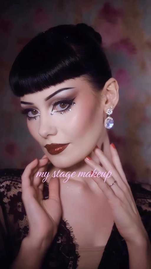 my stage makeup 💌 
this is how I like to do mine but the best thing about show makeup is that it’s so unique to everyone, even to ourselves as it’s always evolving. These are the products I use currently, but as always you can replicate or create a look with any makeup at all 🖤 let me know if you would be interested in a more in depth video :) 
base: 
@milkmakeup hydro grip primer 
@hauslabs triclone skin tech foundation in 030 (I normally like to use a cream or stick foundation but my skins been sensitive and dry lately and this has been working best for me atm) 
#hauslabs sculpt shaping balm in angle 
@hudabeauty faux filter concealer in whipped cream 
@hudabeauty blush filter in strawberry cream 
#hudabeauty easy bake loose powder in sugar cookie 
brows:
my trusty @anastasiabeverlyhills brow pencil in dark brown and black eyeshadow on top 
eyes: 
@colourpopcosmetics stone cold fox palette 
@danessa_myricks colorfix stix in duo 1 interstellar 
@kvdbeauty tattoo liner 
lips: 
the Anastasia brow pencil to define and @diorbeauty rouge dior 666 velvet lipstick with red glitter on top. Hope you love!🖤